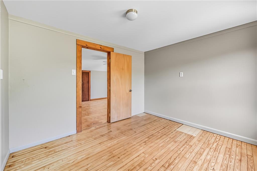 609 Park Avenue Farrell, PA 16121 - Photo 36 of 49 a view of empty room with wooden floor and fan