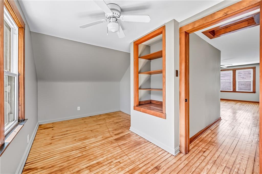 609 Park Avenue Farrell, PA 16121 - Photo 39 of 49 wooden floor in an empty room with a window