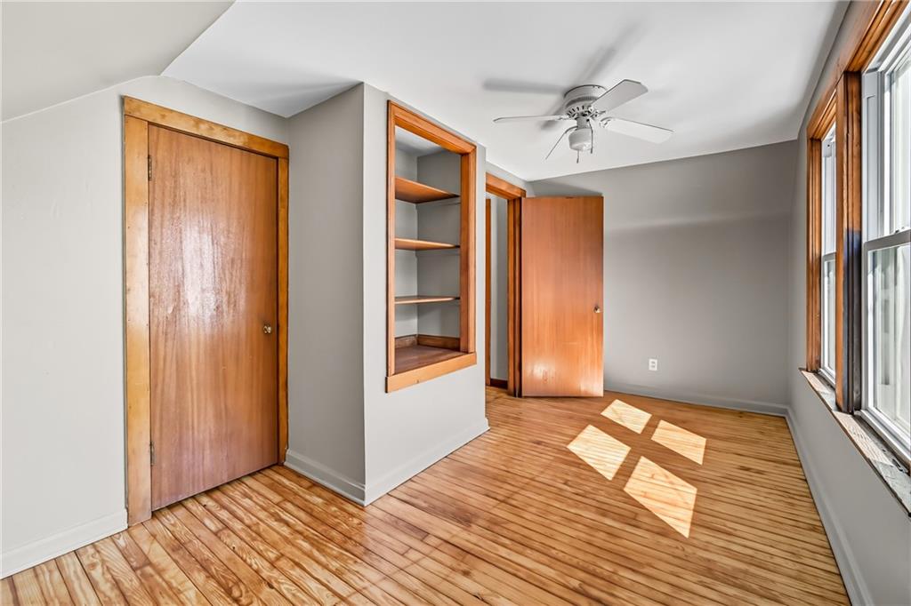 609 Park Avenue Farrell, PA 16121 - Photo 41 of 49 an empty room with wooden floor closet and windows