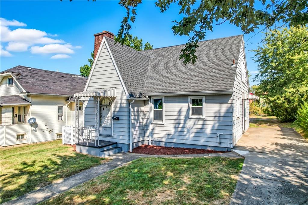 609 Park Avenue Farrell, PA 16121 - Photo 45 of 49 a front view of a house with garden