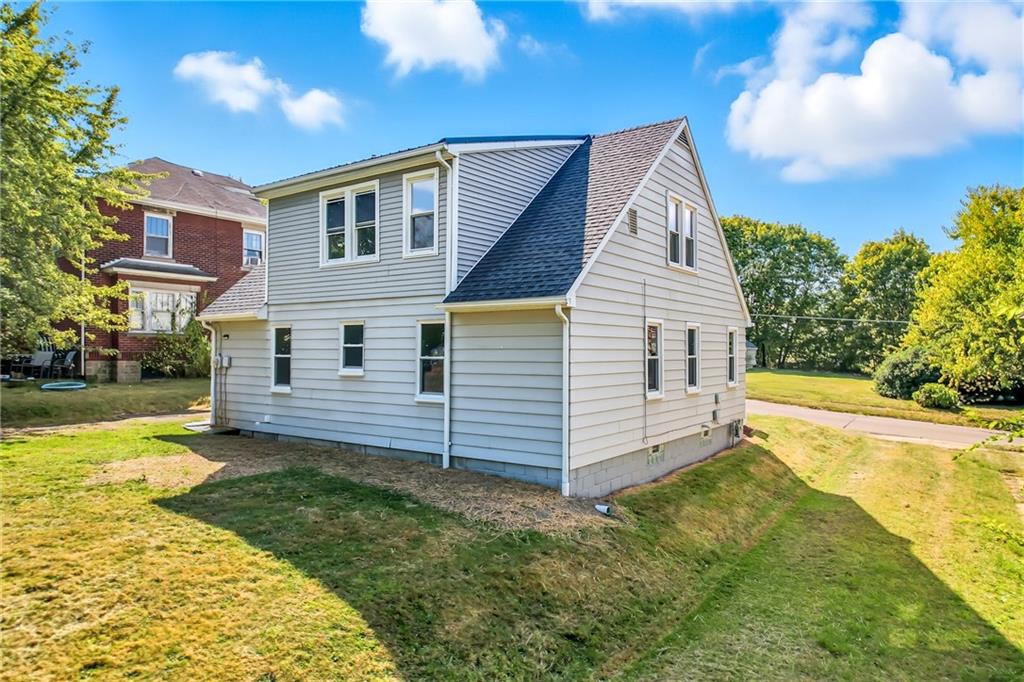 609 Park Avenue Farrell, PA 16121 - Photo 5 of 49 a view of a house with a yard