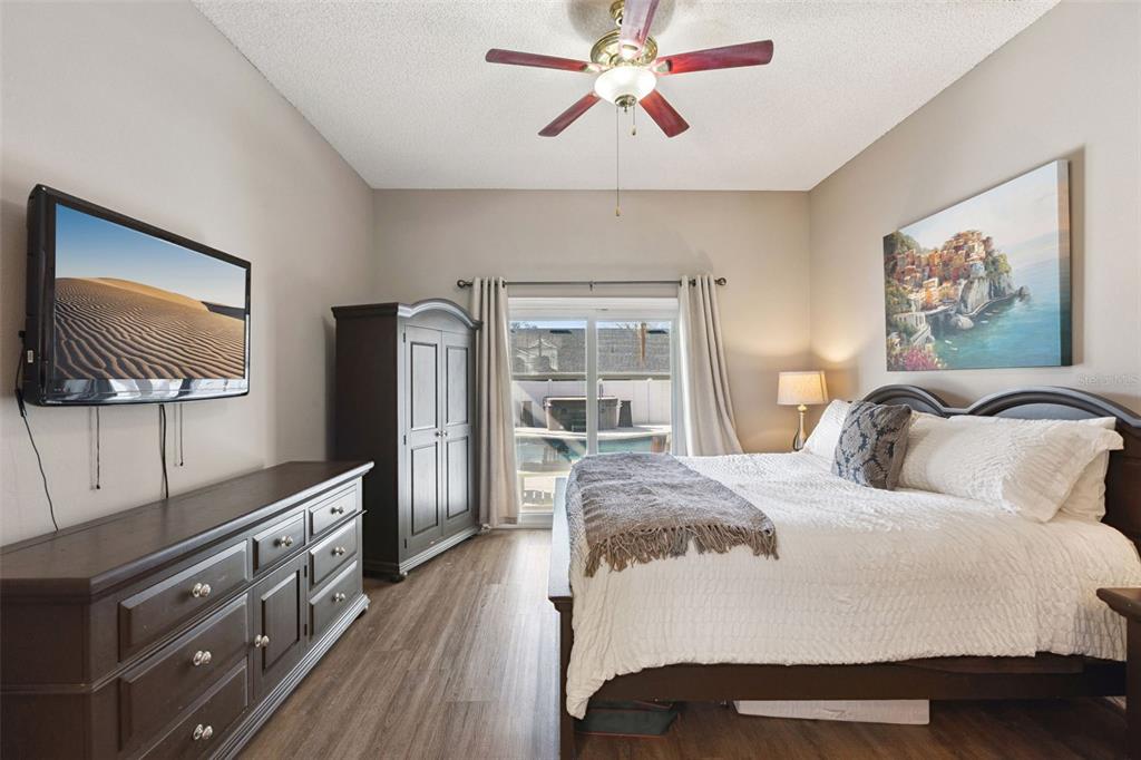 261 Mill Slough Road Oviedo, FL 32766 - Photo 23 of 62 a bedroom with a bed and a flat screen tv
