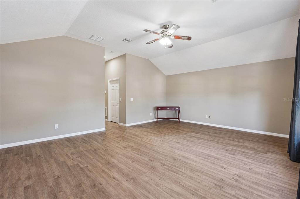 261 Mill Slough Road Oviedo, FL 32766 - Photo 34 of 62 a view of an empty room with wooden floor