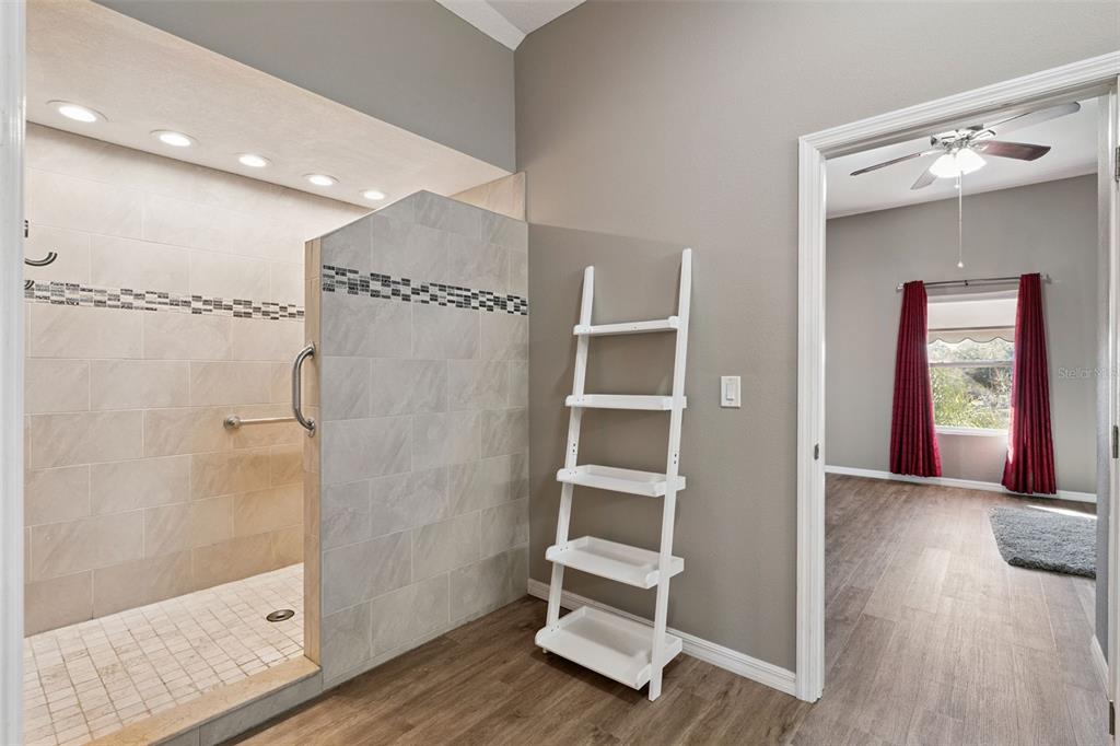 261 Mill Slough Road Oviedo, FL 32766 - Photo 37 of 62 a spacious bathroom with a shower and a glass door