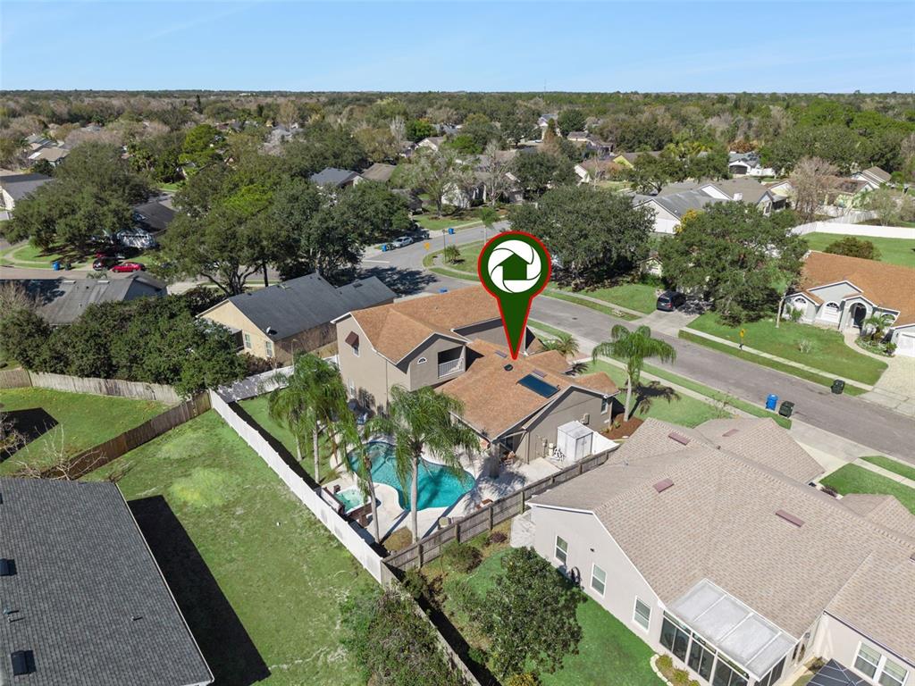 261 Mill Slough Road Oviedo, FL 32766 - Photo 52 of 62 an aerial view of a house with a garden
