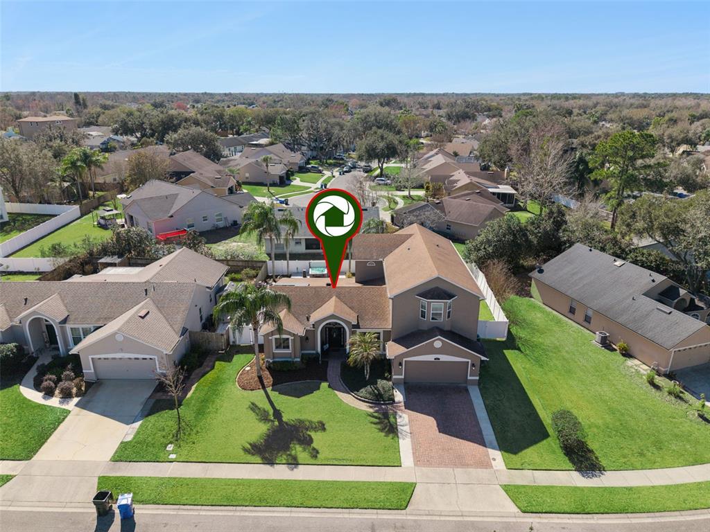 261 Mill Slough Road Oviedo, FL 32766 - Photo 55 of 62 an aerial view of a house with a yard and lake view