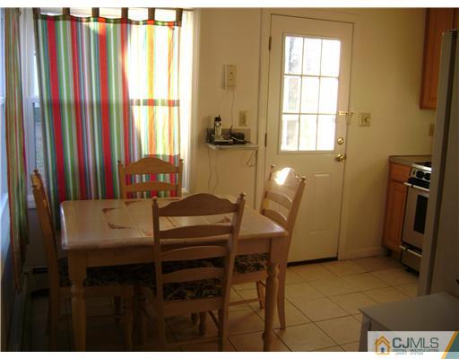14 Mercury Road Edison, NJ 08817 - Photo 2 of 7 a dining room with furniture and a window