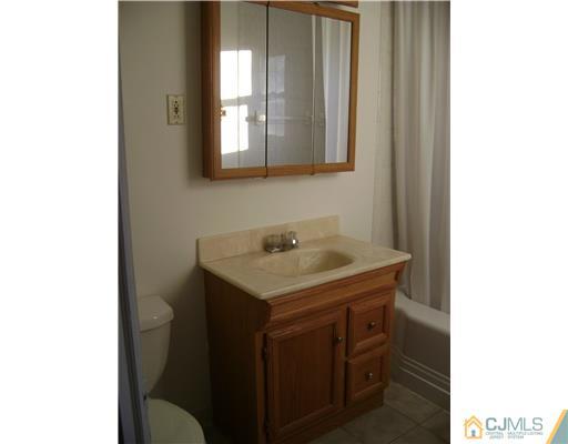 14 Mercury Road Edison, NJ 08817 - Photo 4 of 7 a utility room with a sink