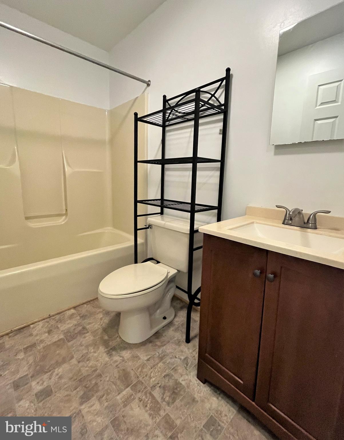 157 Cove Point Road Lusby, MD 20657 - Photo 16 of 19 a bathroom with a toilet a sink and bathtub