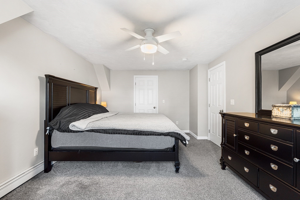 52 Deanville Road Attleboro, MA 02703 - Photo 14 of 30 a bedroom with a bed and a closet