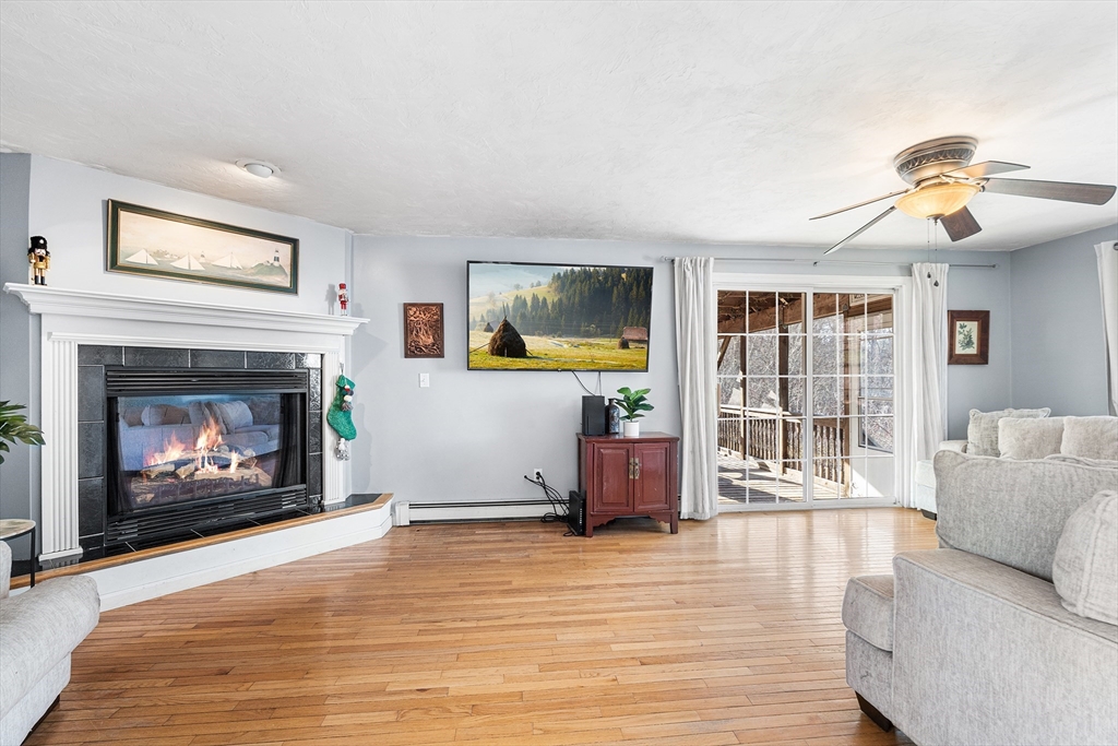 52 Deanville Road Attleboro, MA 02703 - Photo 2 of 30 a living room with furniture and a fireplace