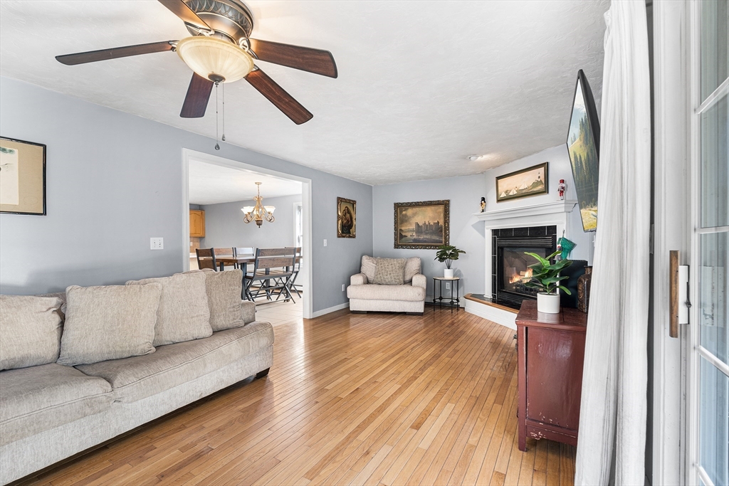 52 Deanville Road Attleboro, MA 02703 - Photo 4 of 30 a living room with furniture and a fireplace