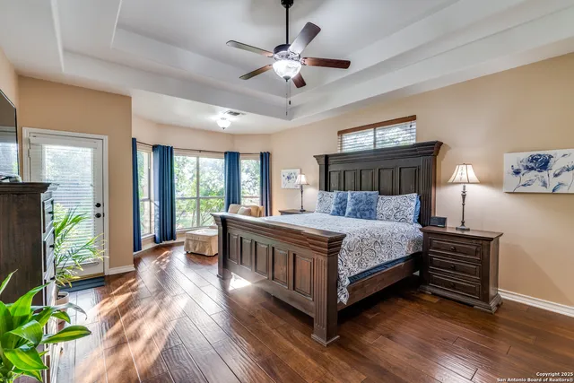 a view of a porch with furniture and backyard