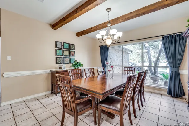 a living room with fireplace furniture and a flat screen tv