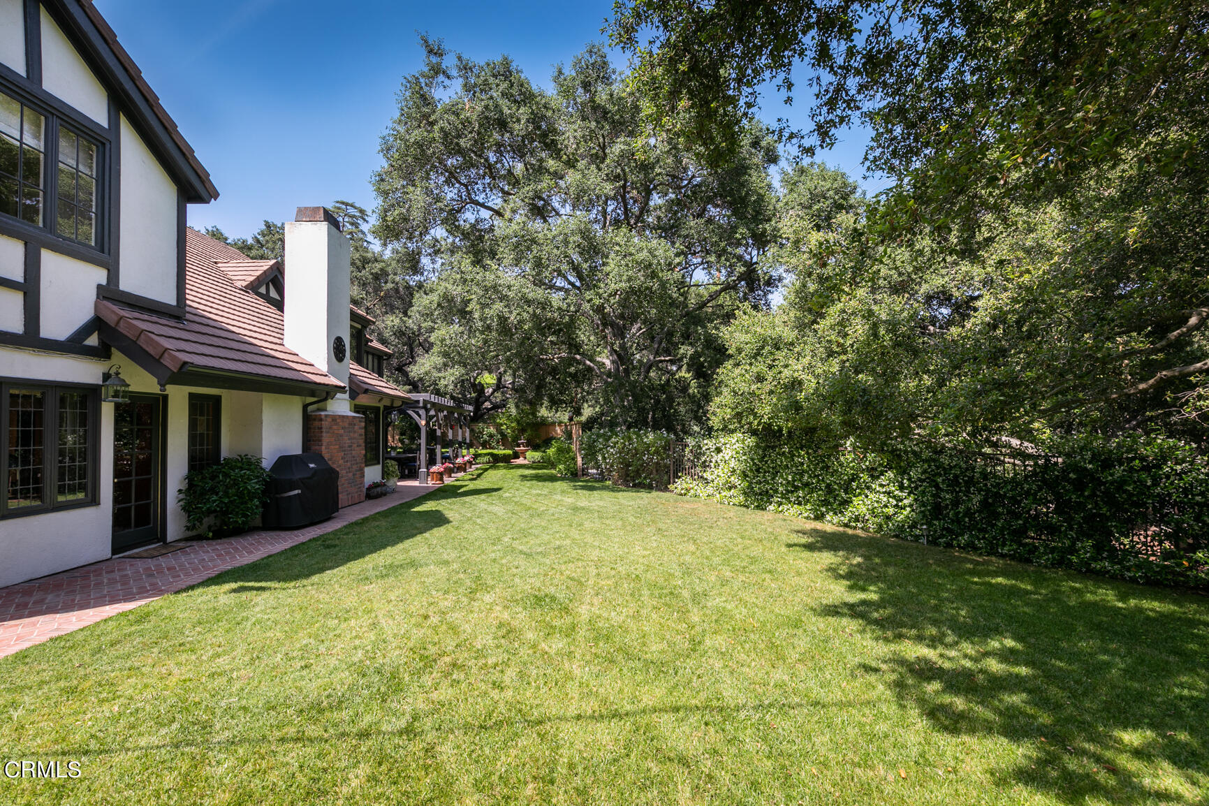 930 Ellington Lane Pasadena, CA 91105 - Photo 59 of 65 a view of a yard with plants and a fountain