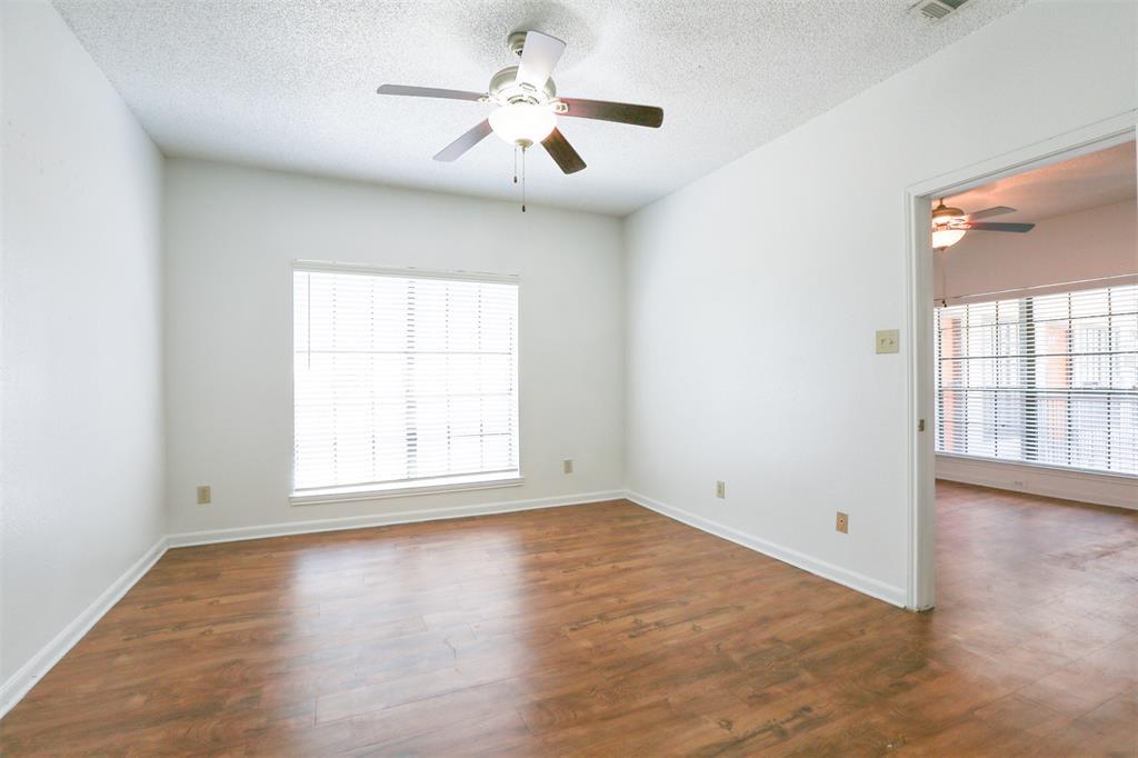 912 West 22nd Street, Unit 106 Austin, TX 78705 - Photo 1 of 11 wooden floor in an empty room with a window