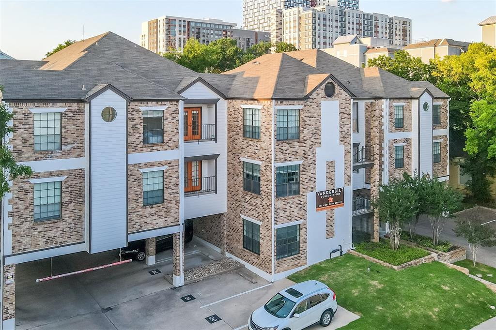 912 West 22nd Street, Unit 106 Austin, TX 78705 - Photo 11 of 11 a front view of a house with a garden