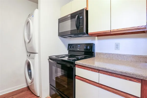 a kitchen with a stove and a microwave