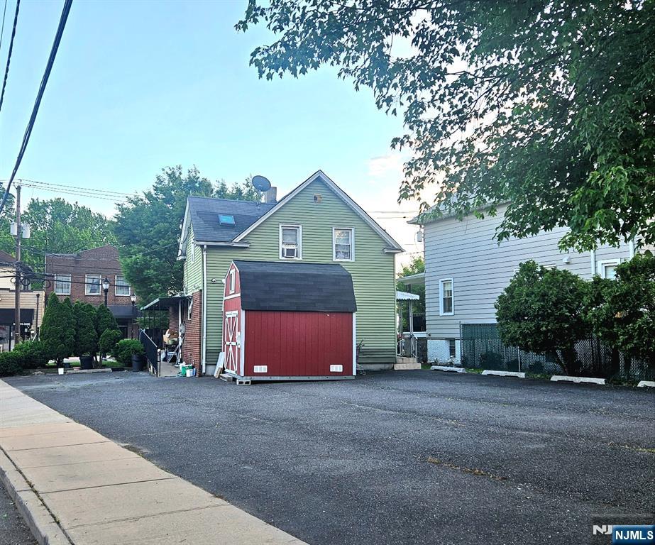 180 Main Street Little Ferry, NJ 07643 - Photo 5 of 8 a front view of a house with a yard