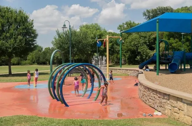 a view of a swimming pool with a patio and a yard