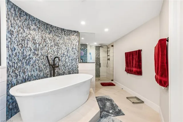 a white bath tub sitting in a bathroom
