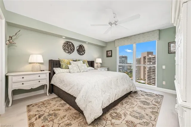 a spacious bathroom with a granite countertop sink a mirror and a shower