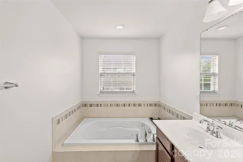 a bathroom with a bathtub and a sink