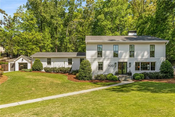 a view of a hallway view with wooden floor and staircase