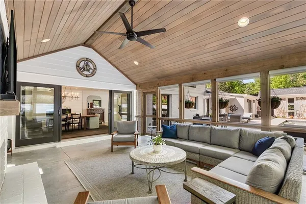 a front view of house with yard and trees in the background