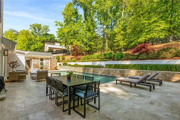 a view of swimming pool with outdoor seating