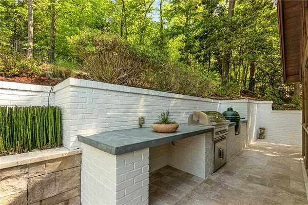 a view of a house with pool and chairs