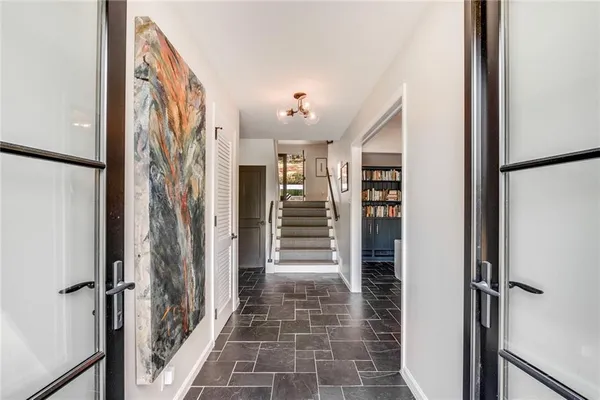 a living room with furniture a dining table and a fireplace