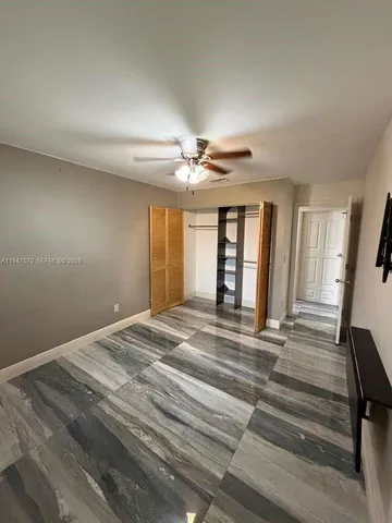 a view of a house with a backyard of a house