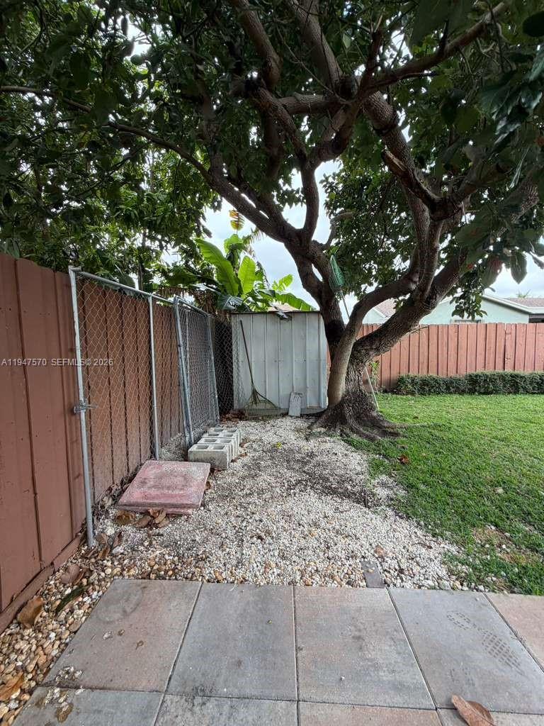 12241 Southwest 268th Street, Unit 1 Homestead, FL 33032 - Photo 18 of 25 a backyard of a house with lots of green space