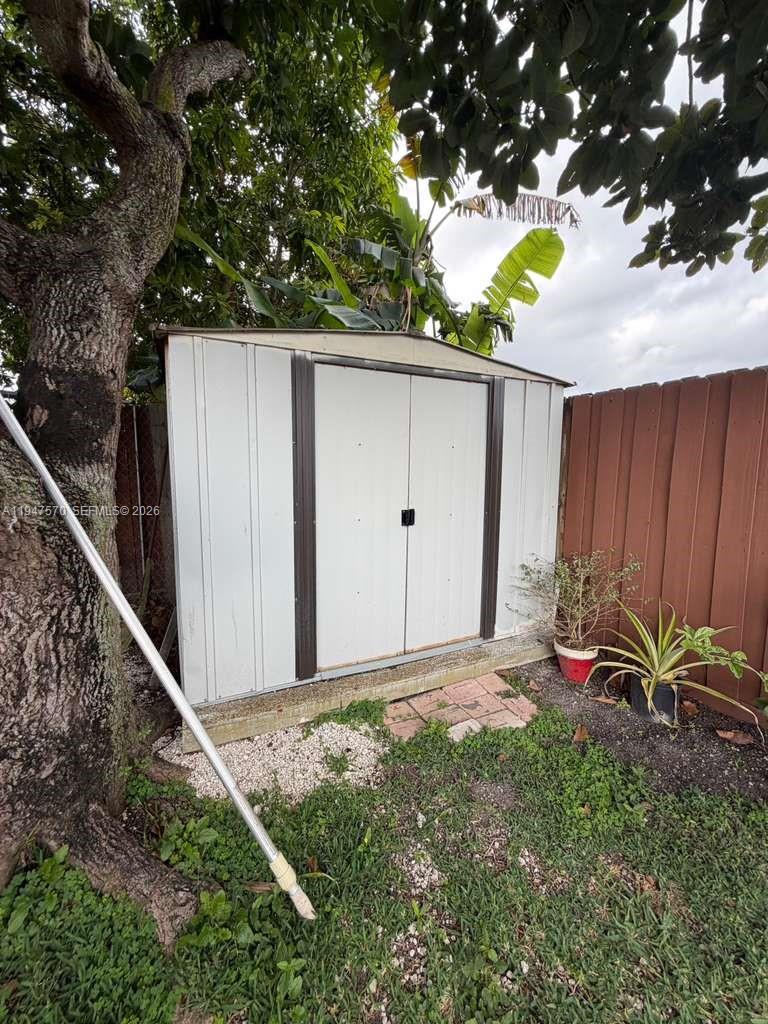 12241 Southwest 268th Street, Unit 1 Homestead, FL 33032 - Photo 19 of 25 a backyard of a house with table and chairs