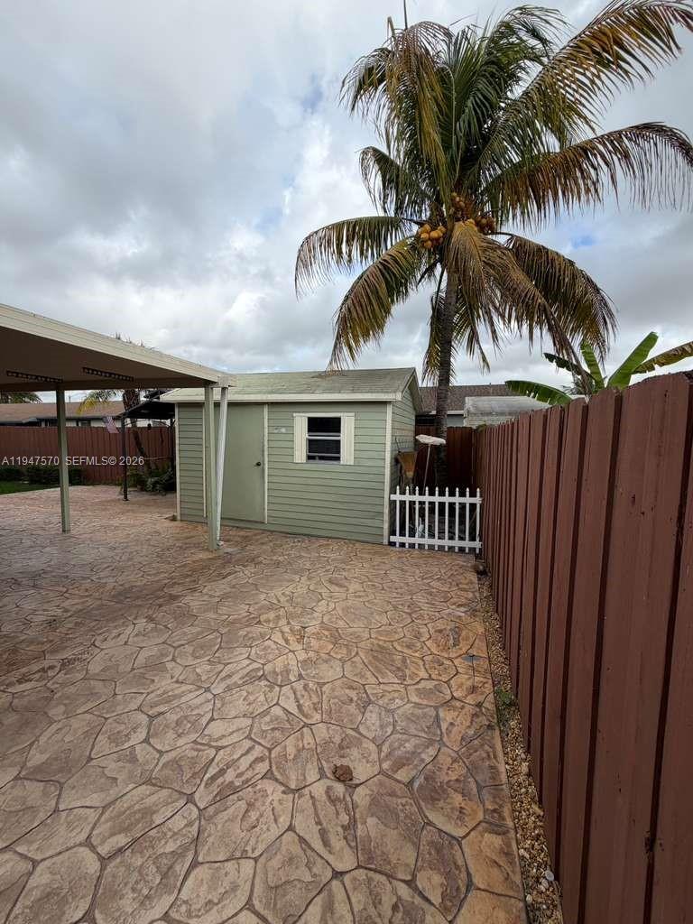 12241 Southwest 268th Street, Unit 1 Homestead, FL 33032 - Photo 21 of 25 a view of a house with a patio