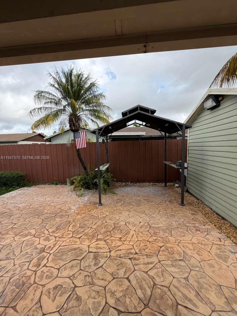 12241 Southwest 268th Street, Unit 1 Homestead, FL 33032 - Photo 22 of 25 a view of a backyard