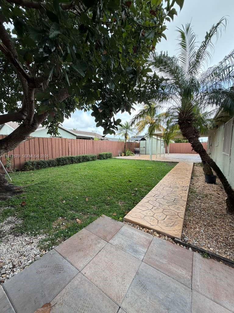 12241 Southwest 268th Street, Unit 1 Homestead, FL 33032 - Photo 24 of 25 a view of backyard with green space