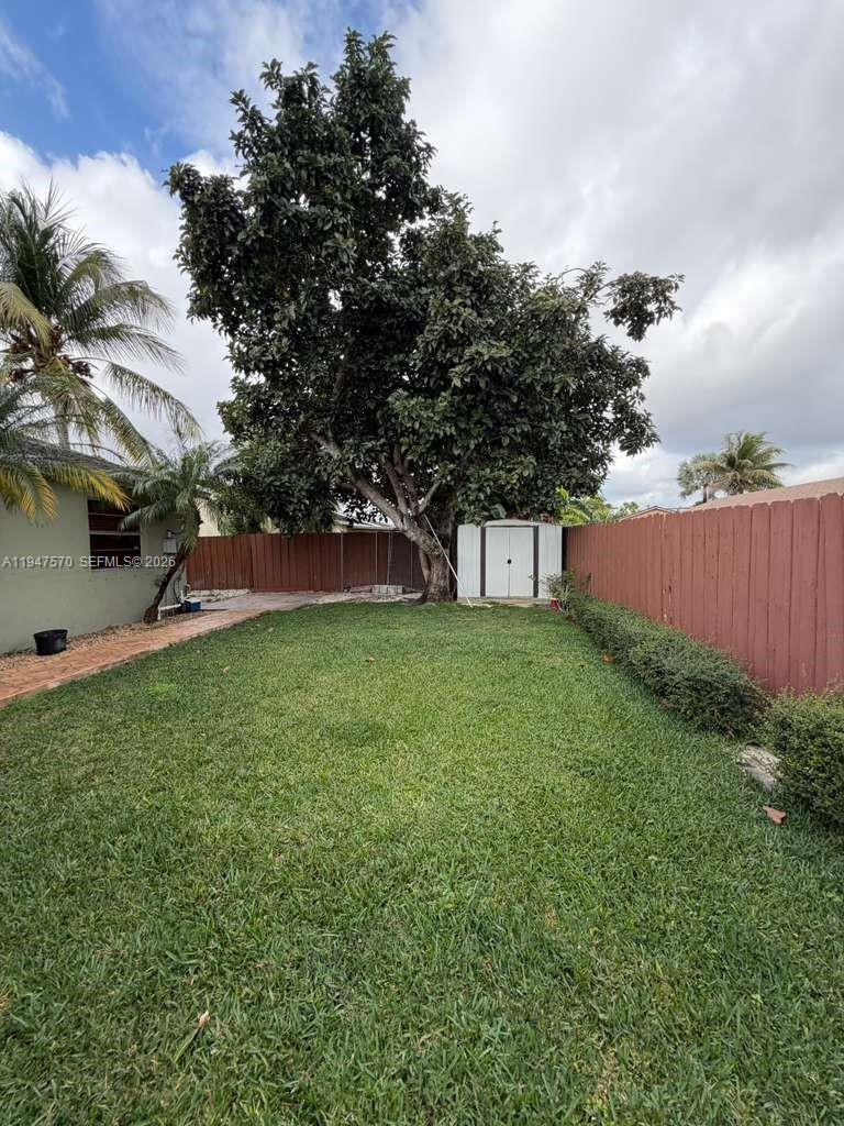 12241 Southwest 268th Street, Unit 1 Homestead, FL 33032 - Photo 25 of 25 a view of a house with a backyard