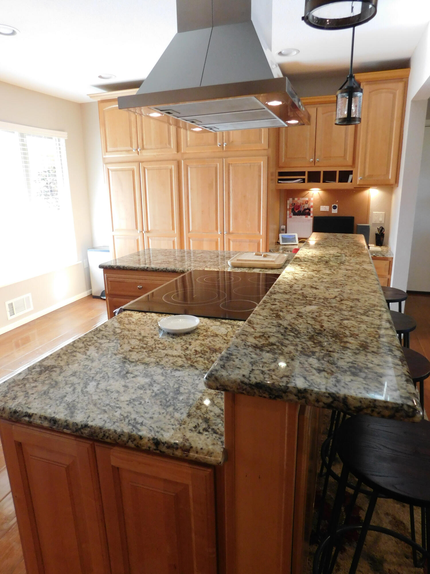 314 West Ave J Muleshoe, TX 79347 - Photo 11 of 40 a view of kitchen island a sink wooden floor and a window