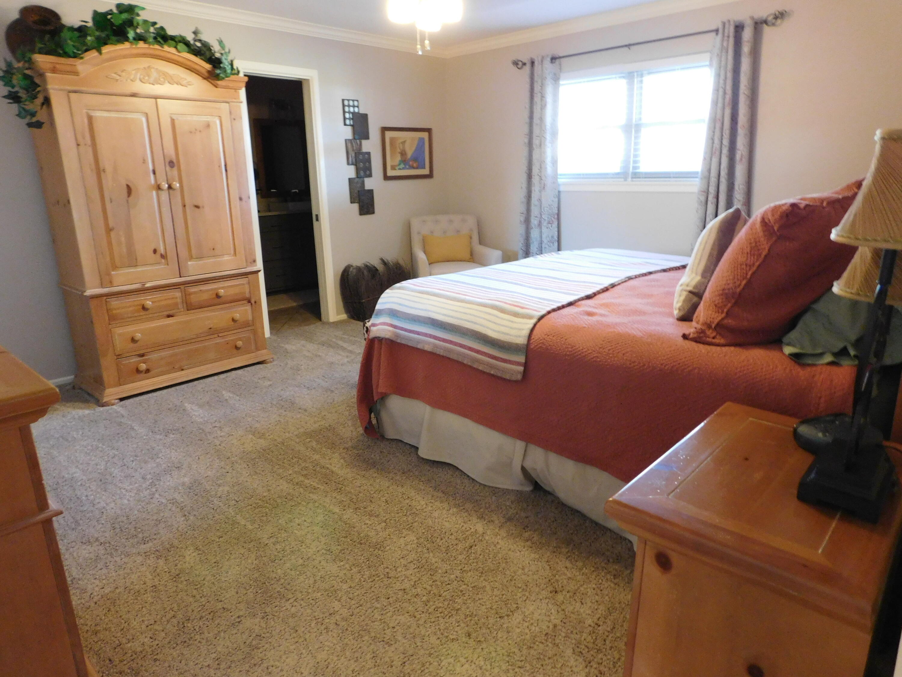 314 West Ave J Muleshoe, TX 79347 - Photo 16 of 40 a bedroom with a bed and a window