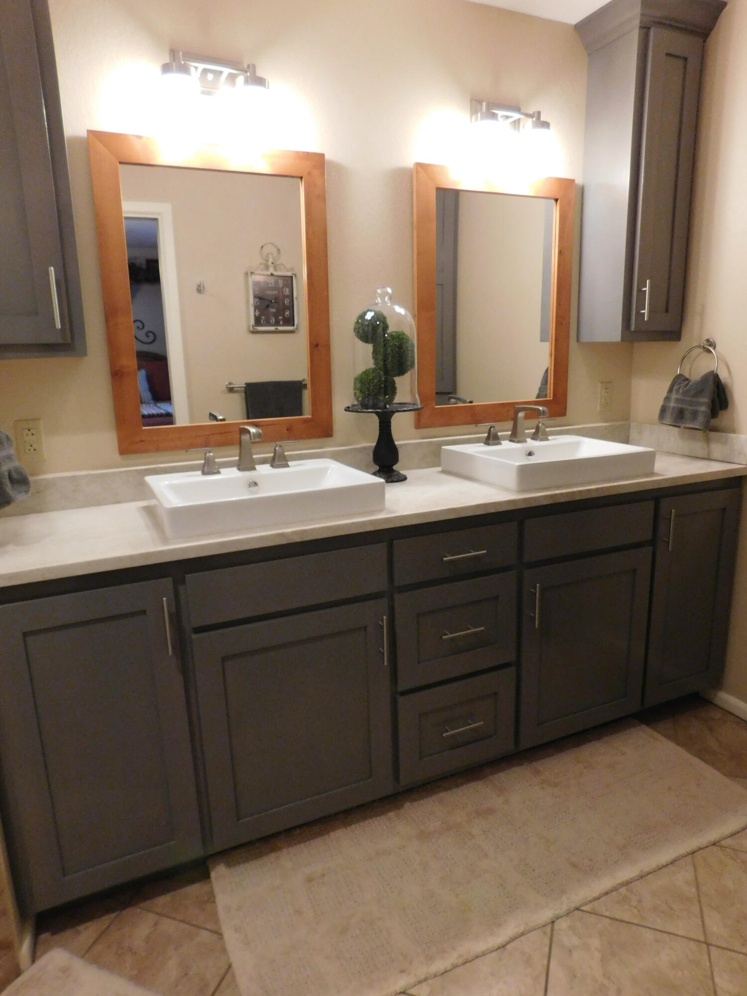 314 West Ave J Muleshoe, TX 79347 - Photo 18 of 40 a bathroom with a double vanity sink and mirror