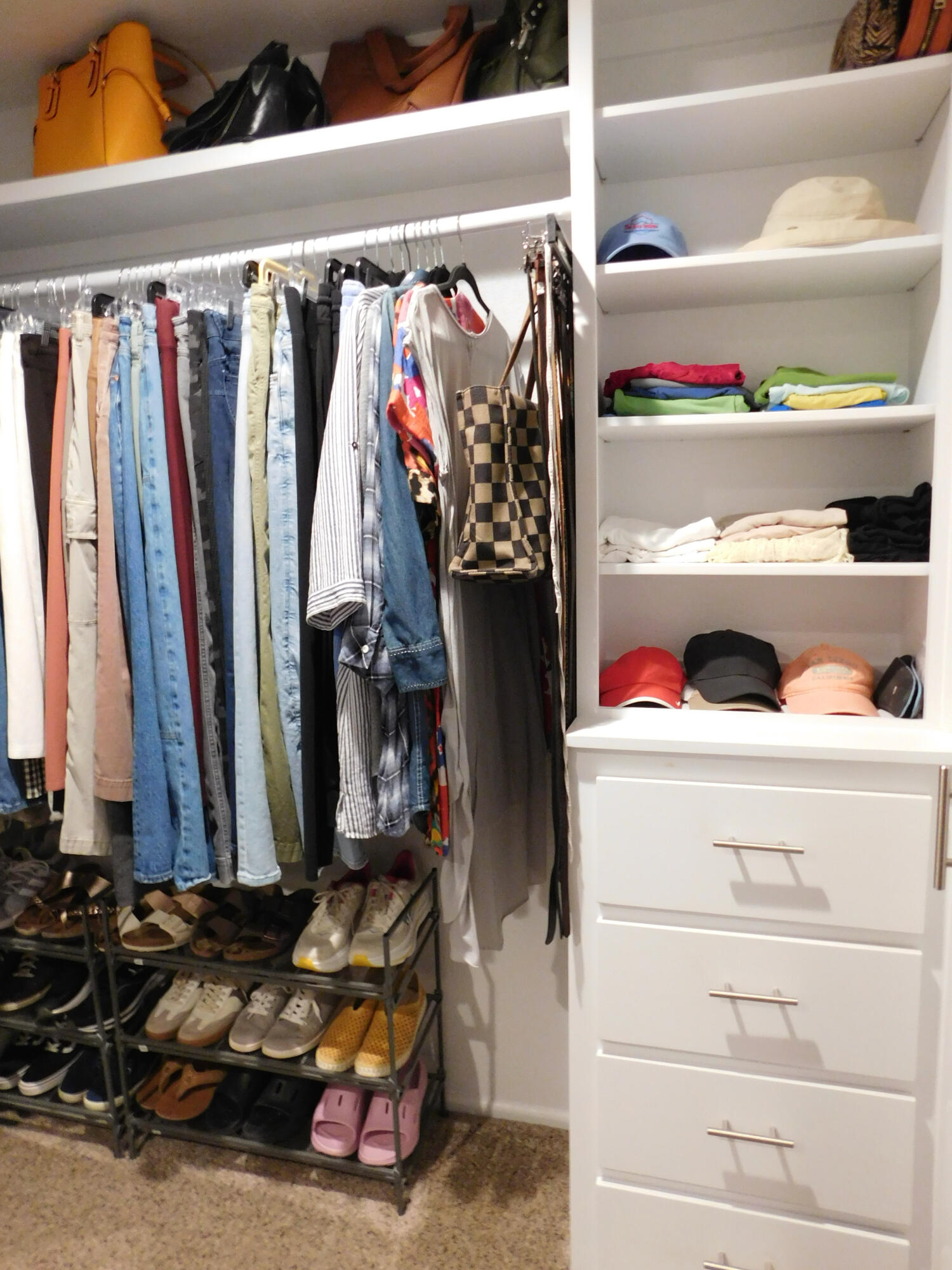 314 West Ave J Muleshoe, TX 79347 - Photo 21 of 40 a view of walk in closet with clothes and shoes