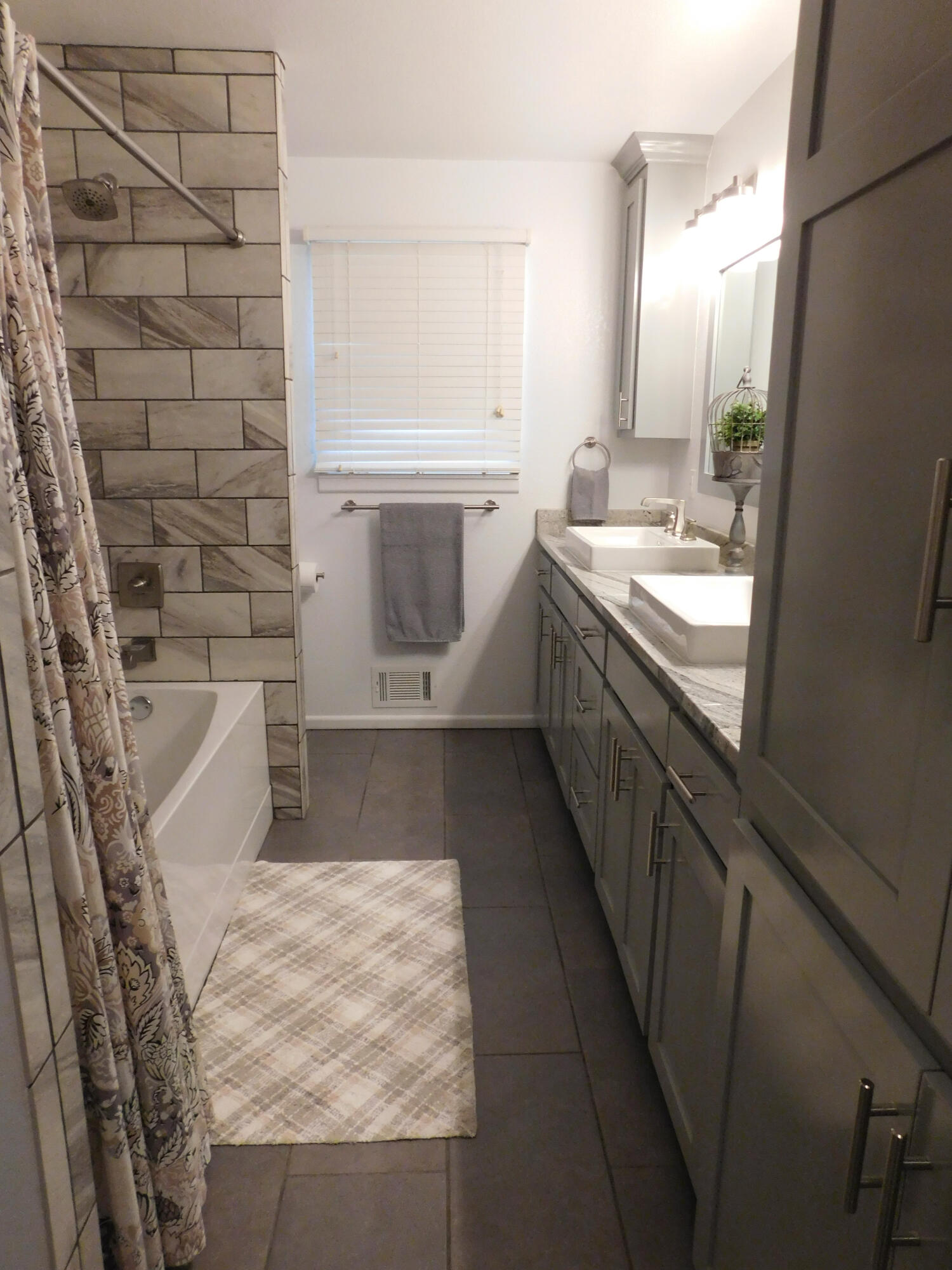 314 West Ave J Muleshoe, TX 79347 - Photo 25 of 40 a bathroom with a sink a vanity and a mirror