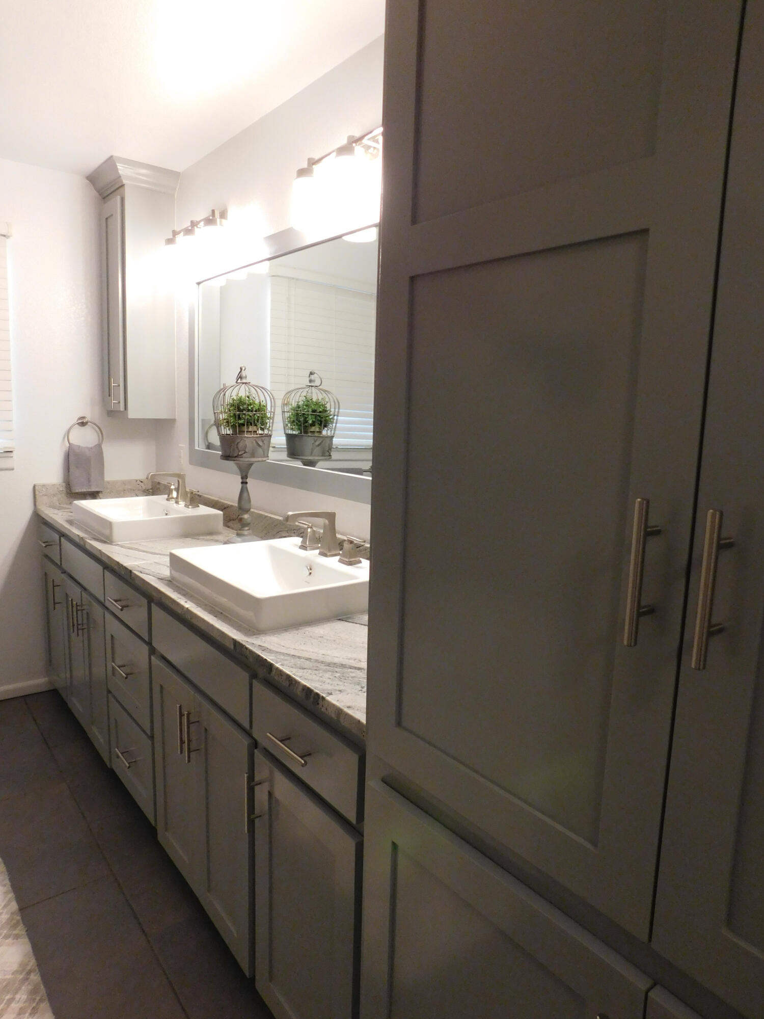314 West Ave J Muleshoe, TX 79347 - Photo 26 of 40 a bathroom with a double vanity sink and mirror