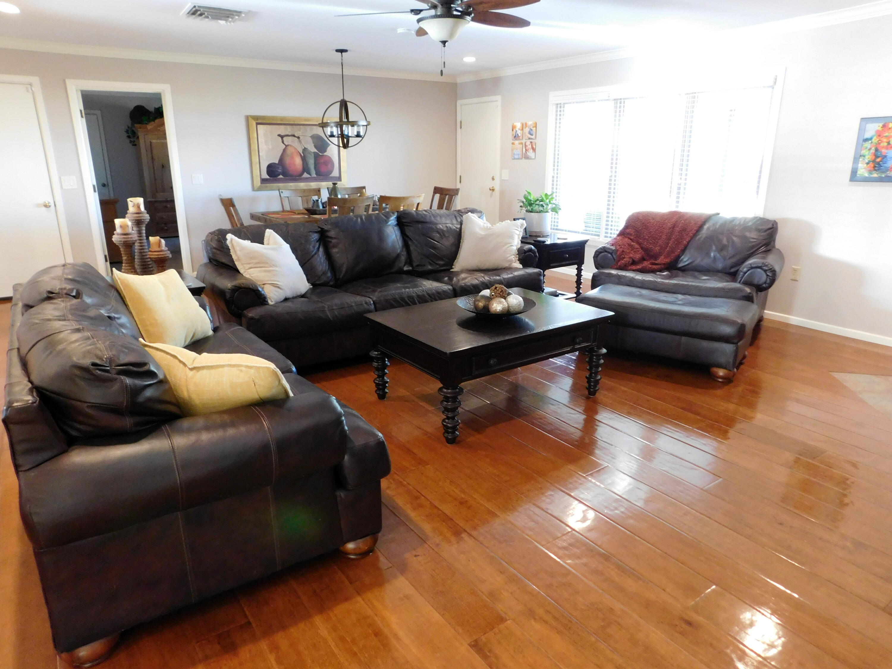 314 West Ave J Muleshoe, TX 79347 - Photo 4 of 40 a living room with furniture and a wooden floor