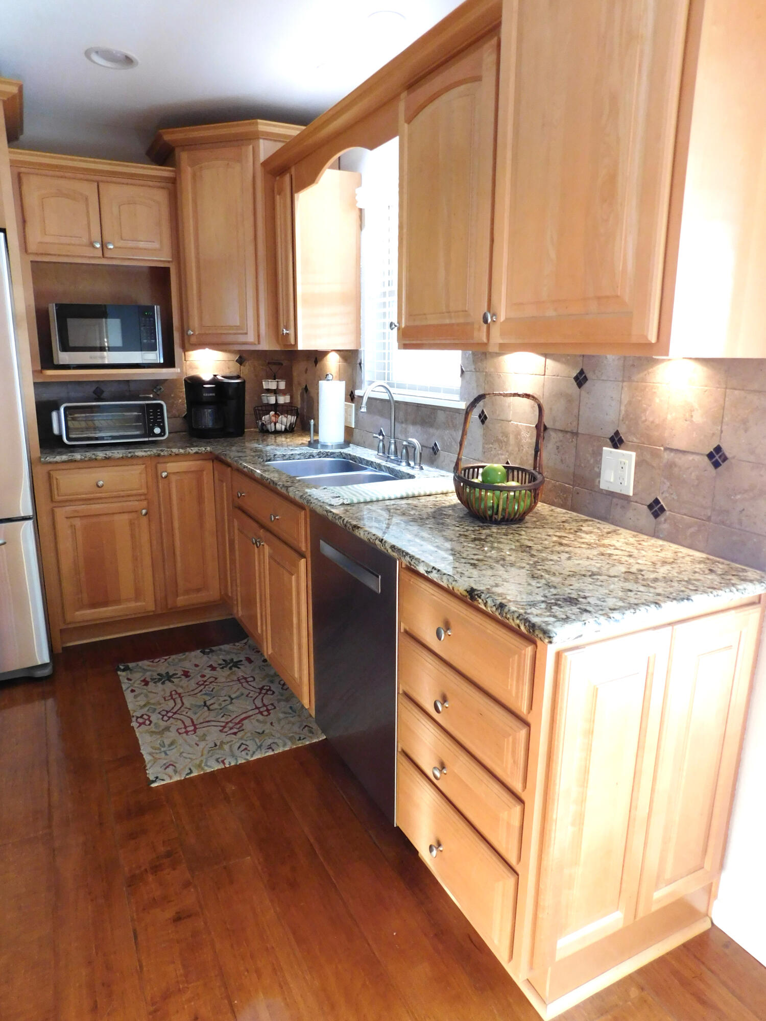 314 West Ave J Muleshoe, TX 79347 - Photo 8 of 40 a kitchen with sink a microwave and cabinets