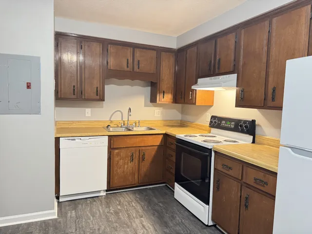 a kitchen with a sink cabinets and stainless steel appliances