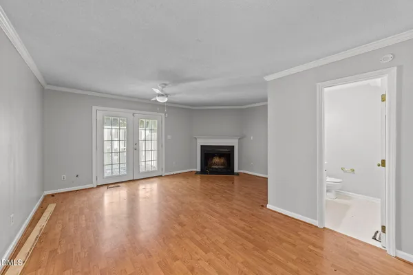 a bedroom with a bed and a fireplace