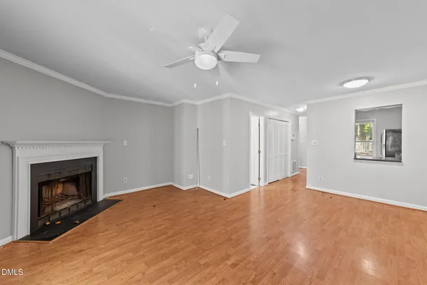 wooden floor in an empty room with a window